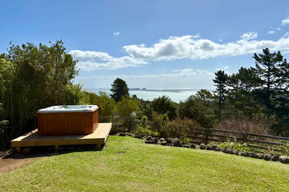 Private spa pool at Whitestar Station's Ocean View Retreat, looking out to Motumakareta Island and Motukahaua (Happy Jack) Island across the Hauraki Gulf.